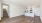 living room with wood floors and kitchen