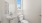 bathroom with window above toilet