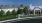 a building with a lawn and trees