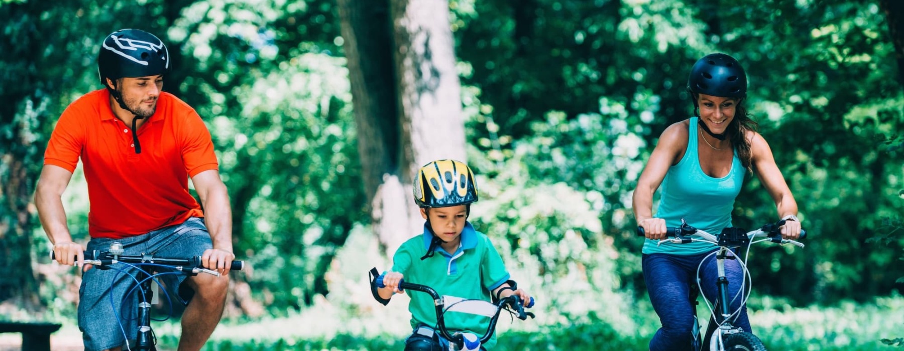 a family bicycling outdoors